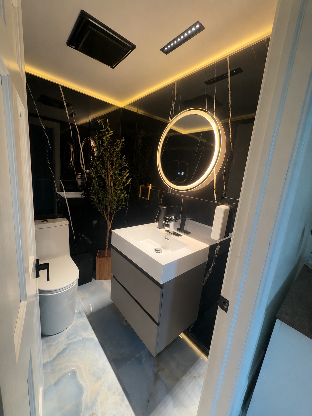Custom bathroom lighting, illuminated mirror and electrical finish by Brens Electric