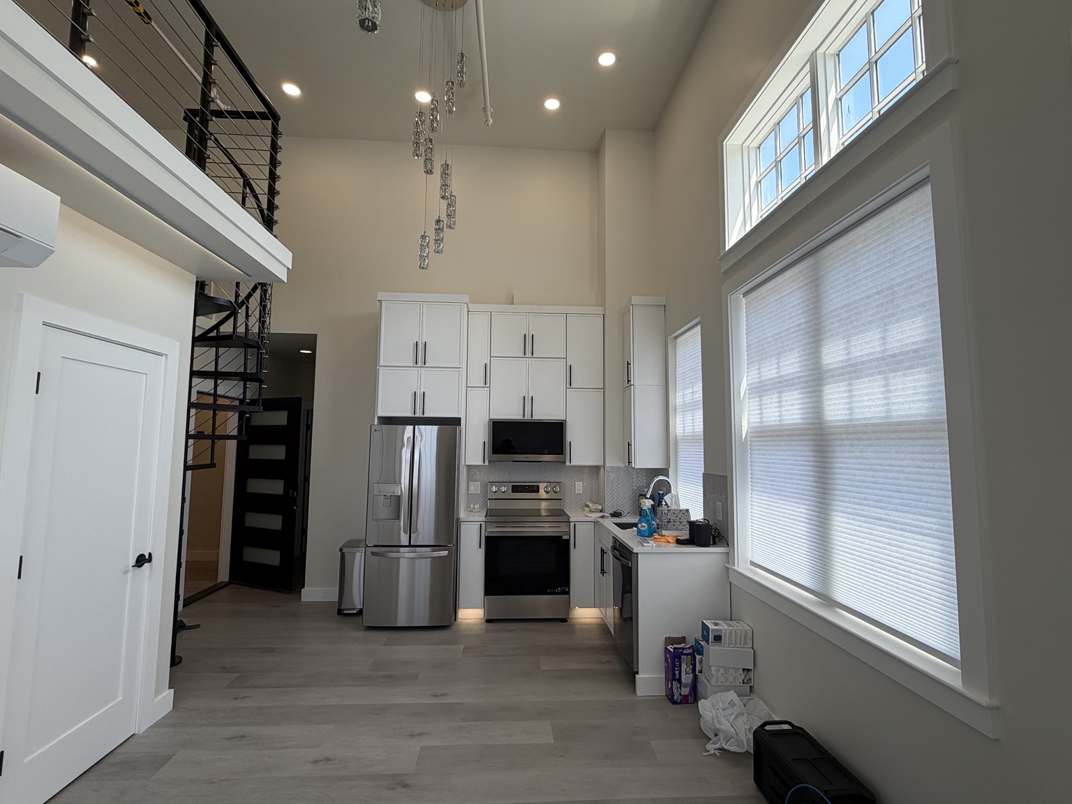 High ceiling custom home with recessed, pendant and architectural lighting by Brens Electric