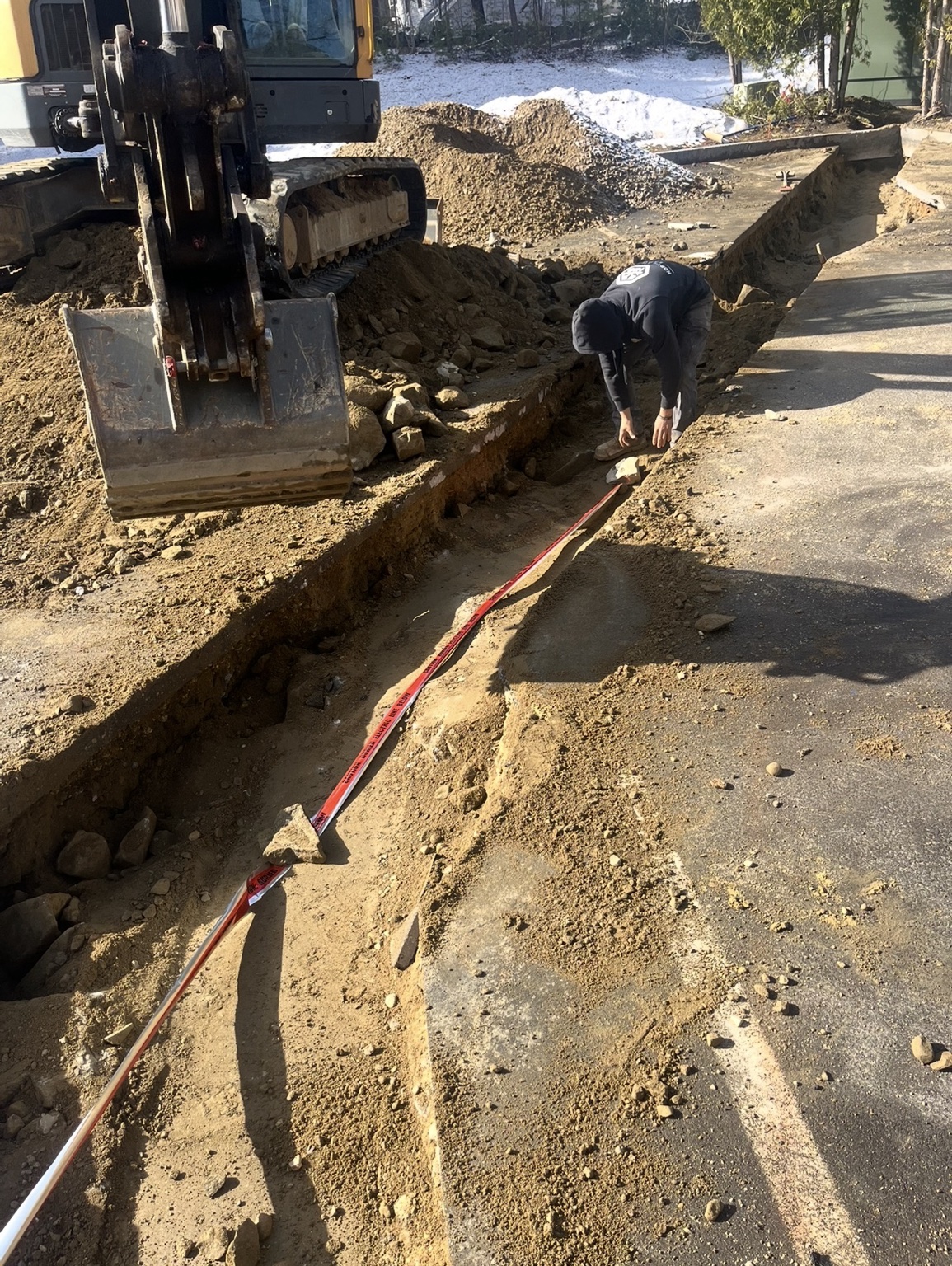 Underground electrical utility trench and service pathway under construction
